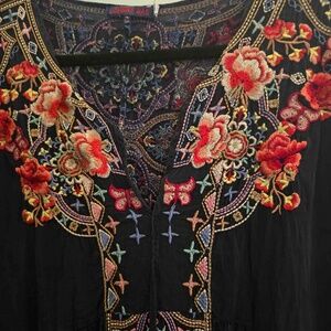 Johnny was  dark navy color tunic or dress